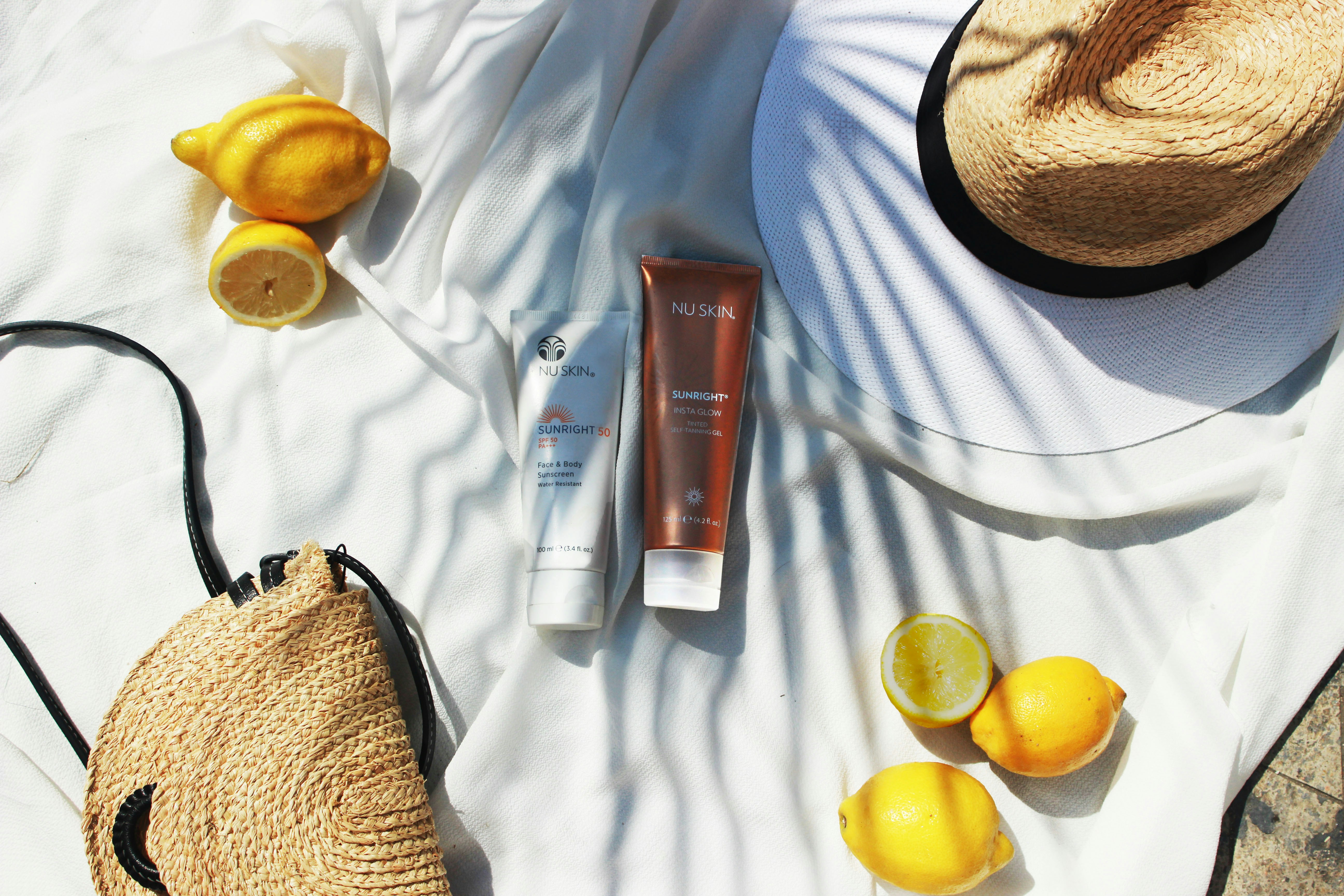 Summer health essentials including sunscreen, water bottle, fresh fruits, sunglasses, and hat for staying healthy during summer